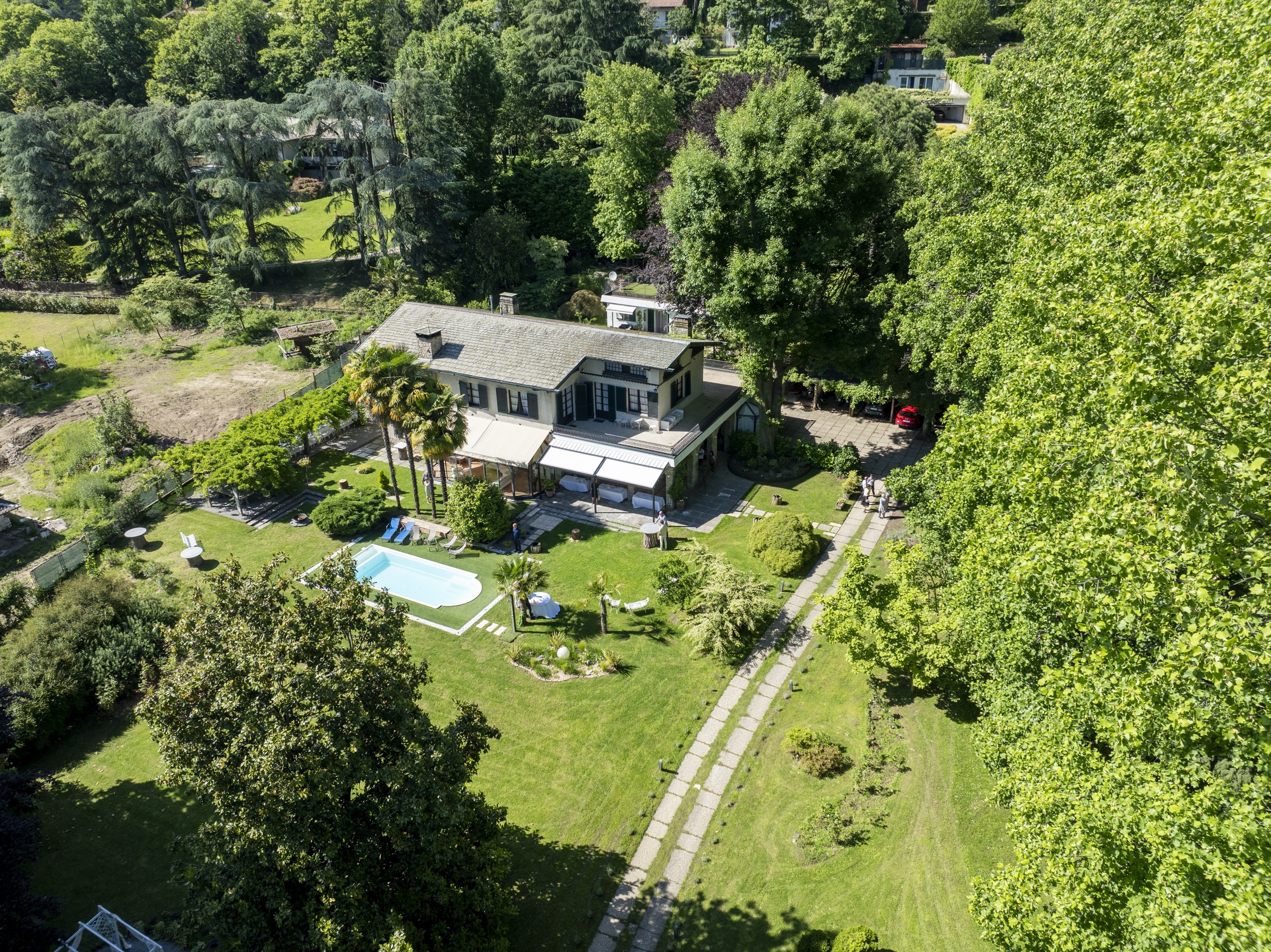The villa from above, set in woodland with the long drive and the pool, Villa Sofia