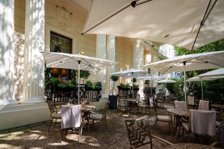 The Terrace under parasols against the Georgian colonnade, 116 Pall Mall