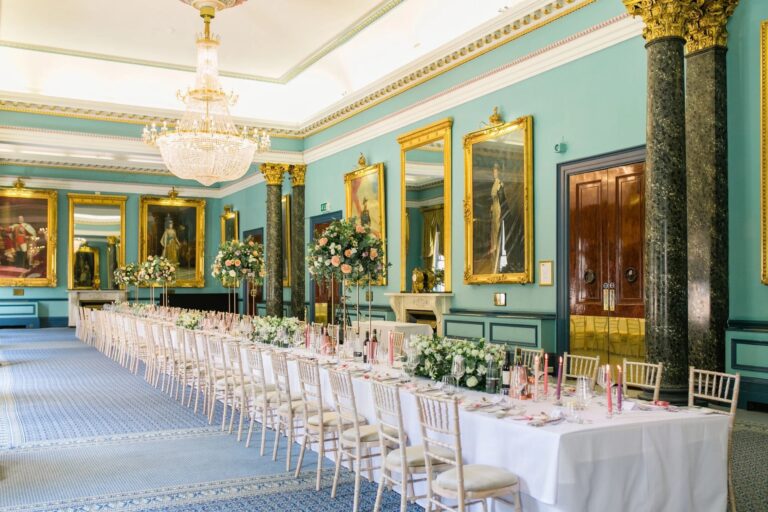 Long banqueting tables dressed in white and gold in the Nash, 116 Pall Mall