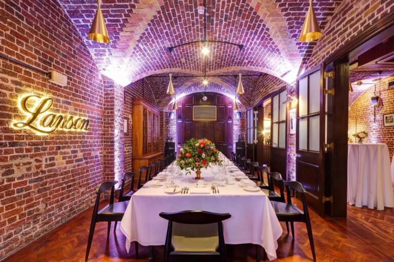 The Champagne Bar annexe, a vaulted brick cellar dressed for dinner, 116 Pall Mall