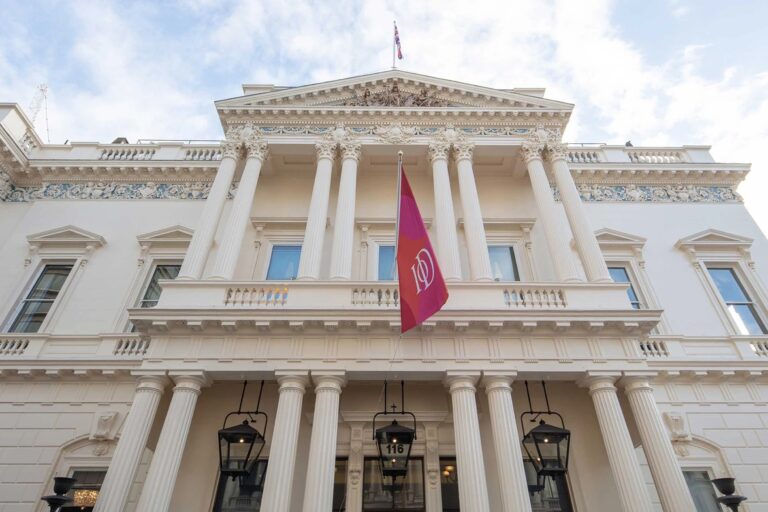 The Grade I listed John Nash portico on Pall Mall, the IoD standard flying, 116 Pall Mall