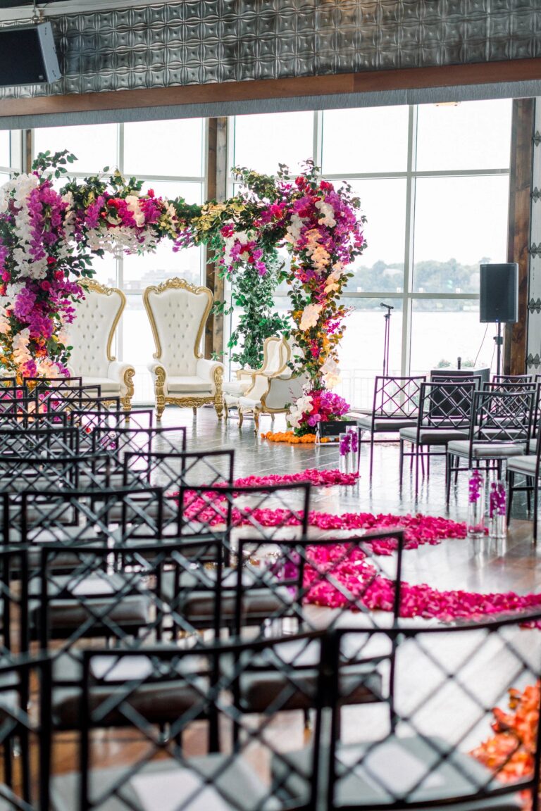 Ceremony set up with a petal-lined aisle and floral mandap at Pier Sixty, New York, 5th Avenue Weddings