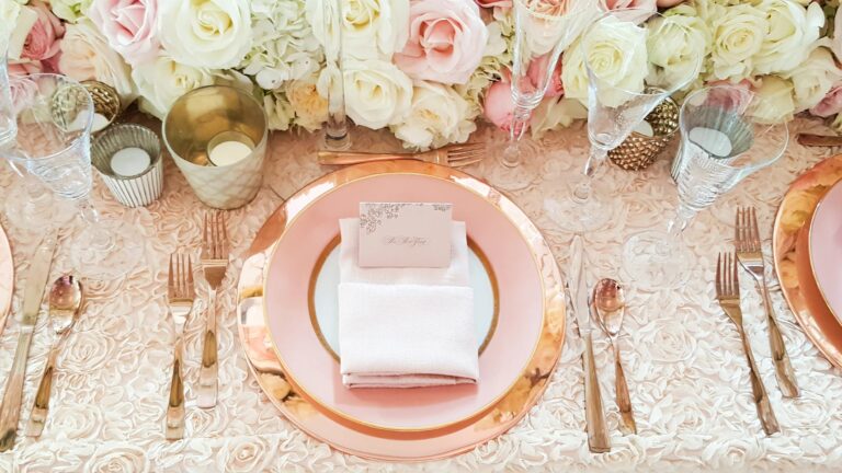 Blush linen, gold flatware and rose centrepiece on a rooftop wedding table, 5th Avenue Weddings