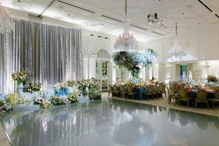 Ballroom with a mirrored dance floor and blue and white floral installations, About Details Details
