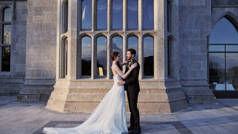 A couple outside the Manor House windows, Adare Manor