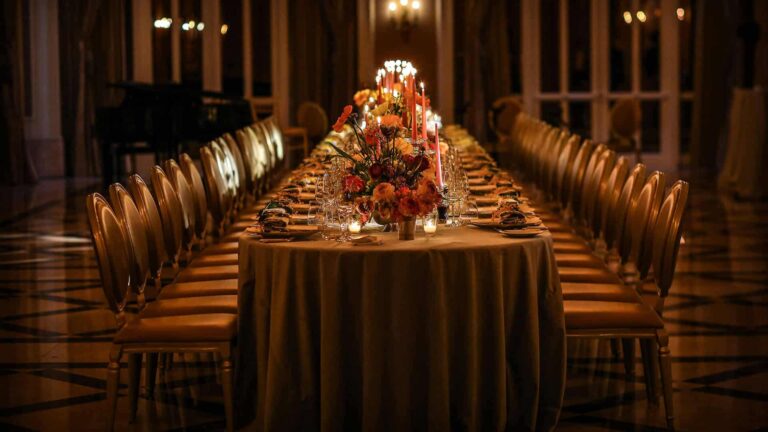 A long candlelit banquet table, Adare Manor