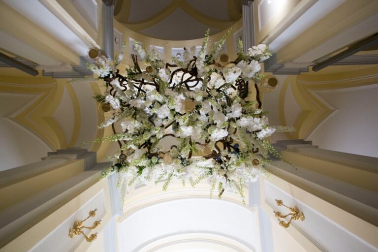 Chandelier of white flowers hung beneath a frescoed ceiling, Villa Vittoria, Alba Greco
