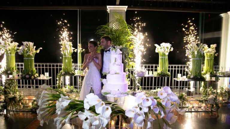 Couple at the cake with sparklers and white calla lilies on a terrace, Costiera Sorrentina, Alba Greco