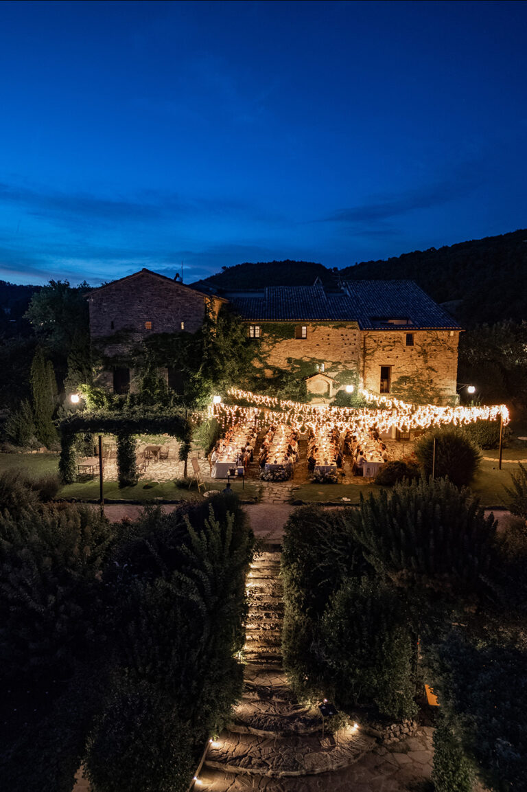Candlelit garden and stone farmhouse at blue hour, Alessandro Mari Photography