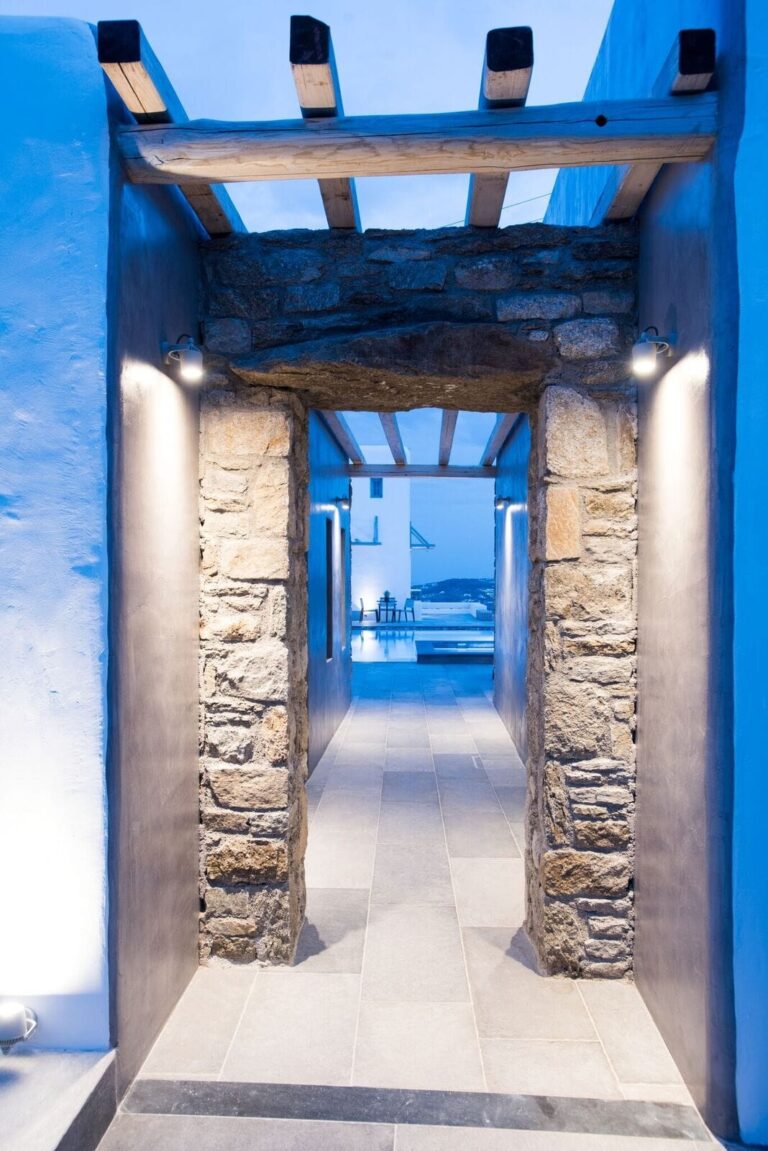 A lit entrance archway at night