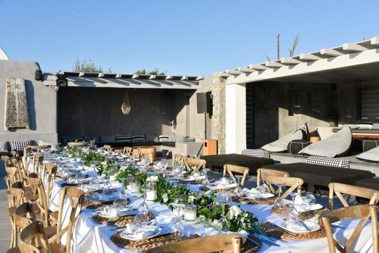 A long reception table under the pergola