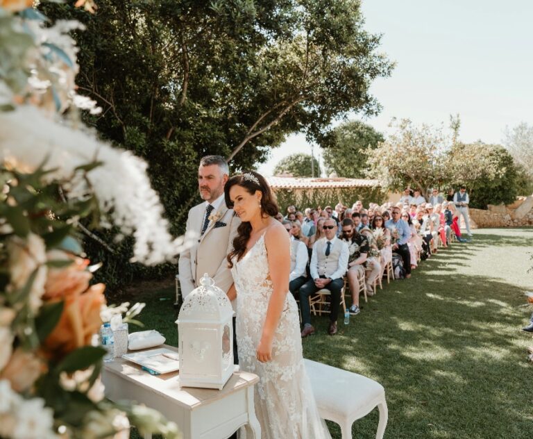Couple at the ceremony in front of seated guests, Algarve Wedding Planners