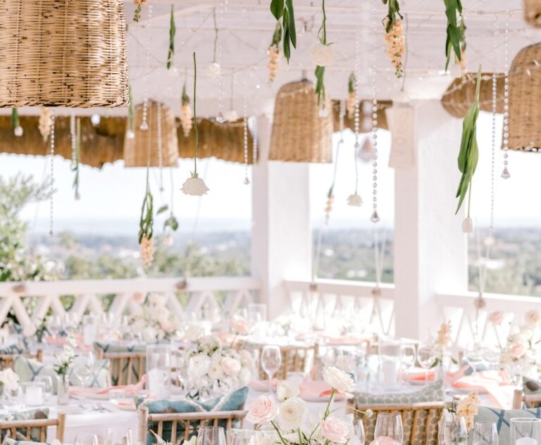 Reception terrace with hanging woven baskets and pastel table settings, Algarve Wedding Planners