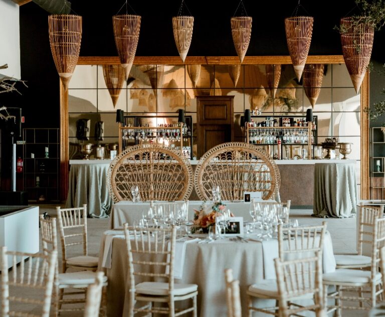 Reception room with rattan chairs and round tables, Algarve Wedding Planners