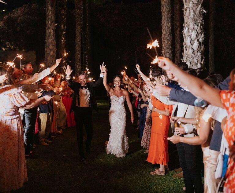 Guests lining the path with sparklers for the couple at night, Algarve Wedding Planners
