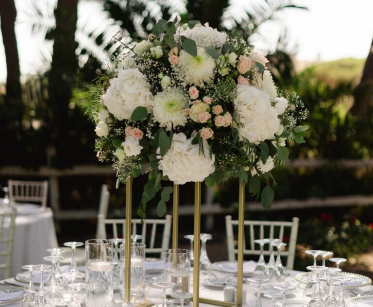 Tall white floral centrepiece on a reception table, Algarve Wedding Planners