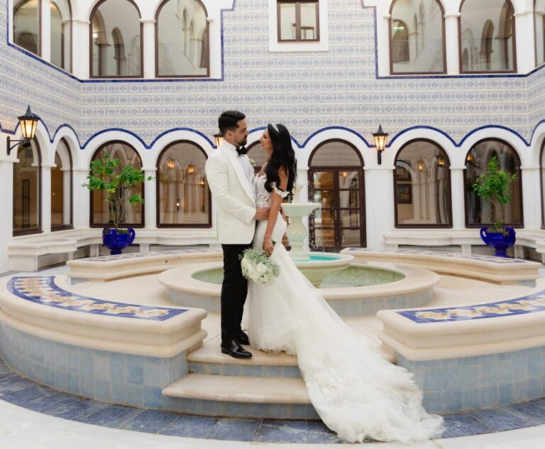 Couple in a tiled courtyard with a fountain, Algarve Wedding Planners