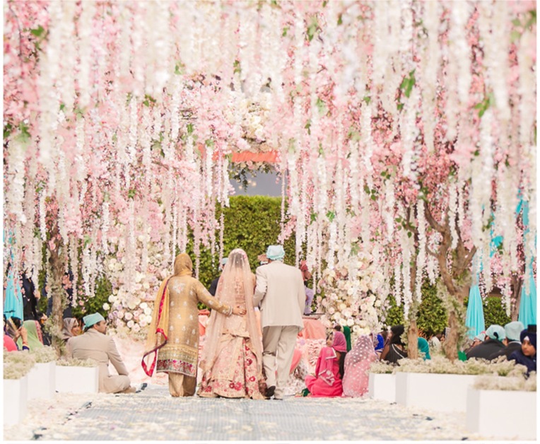 Blossom-hung aisle leading to the ceremony seating, Aliana Events