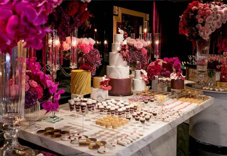 Dessert table with tiered cakes, sweets and magenta orchids, Aliana Events