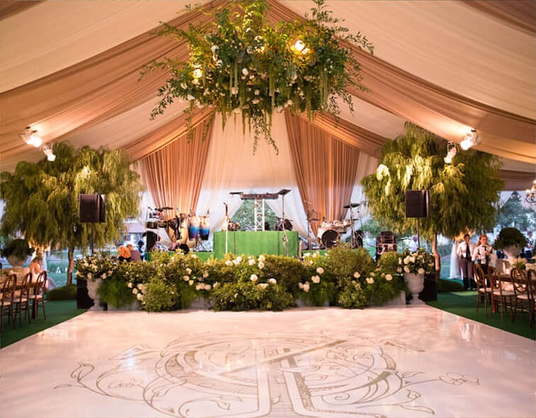 Tent dance floor with monogram and hanging greenery installations, Aliana Events