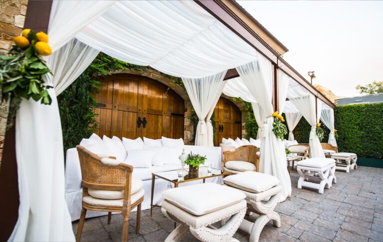 Terrace lounge beneath white draped canopies, Aliana Events