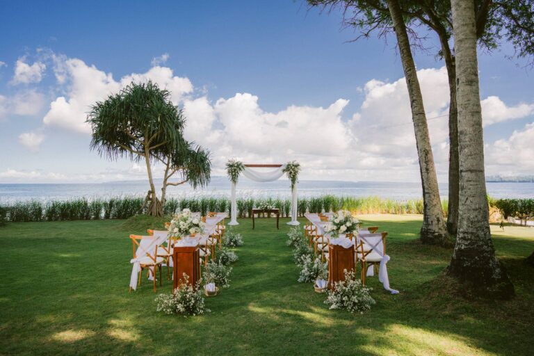 An aisle and arch set on the lawn by the ocean, Alila Manggis