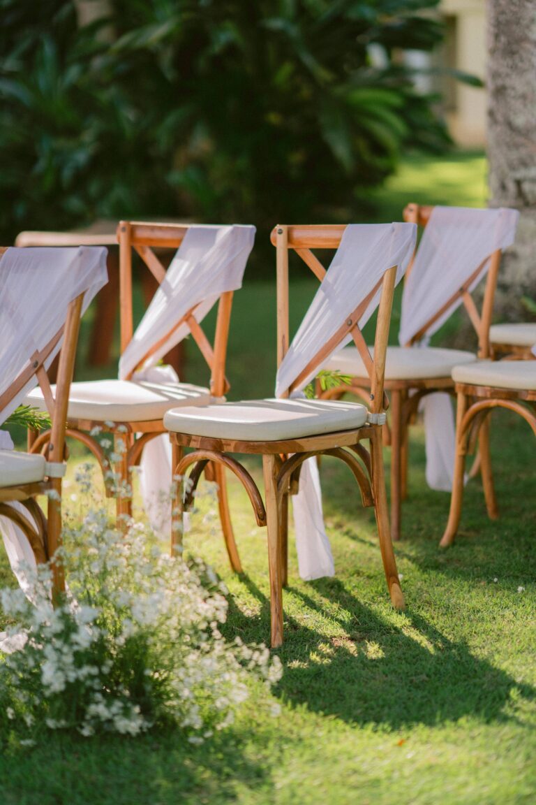 Chairs dressed with white drapes and flowers, Alila Manggis