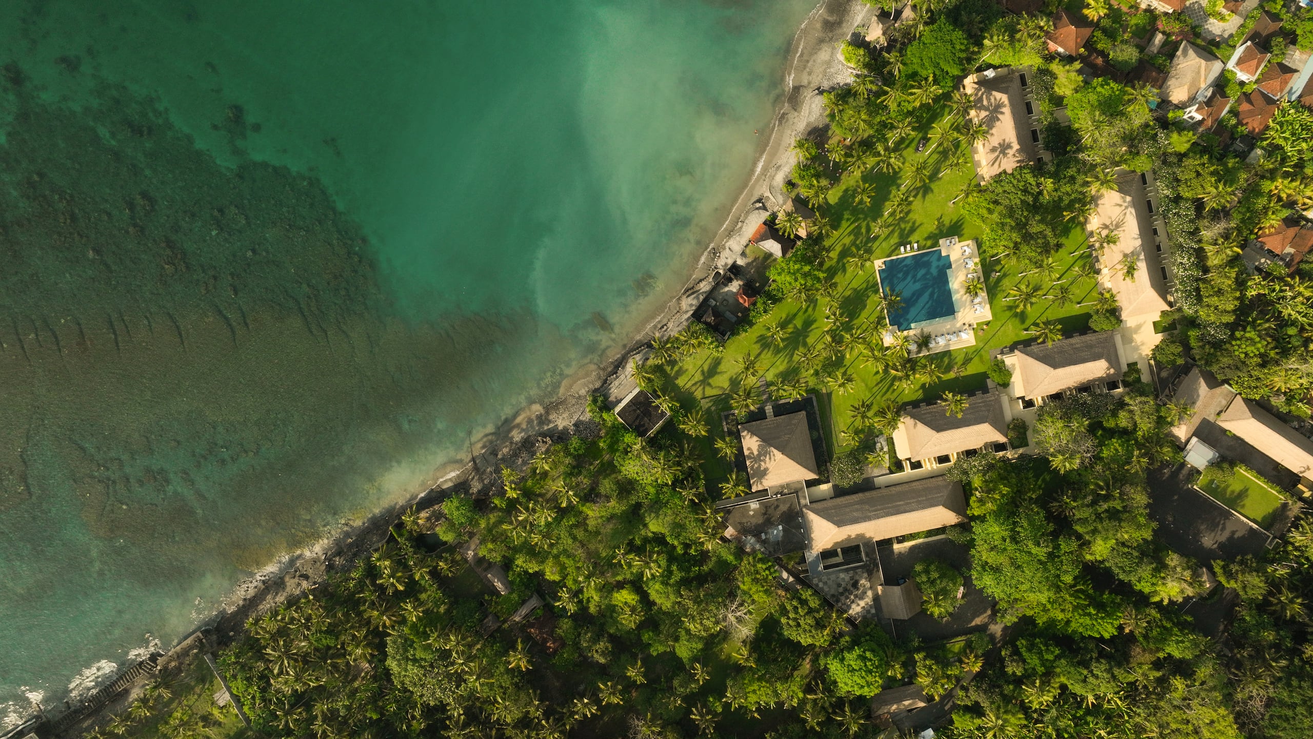 Pavilions and pool along the east coast shoreline, Alila Manggis