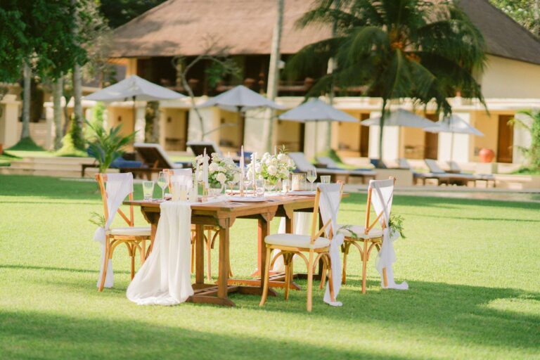 A reception table on the lawn in front of the pavilions, Alila Manggis
