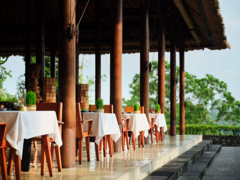 Plantation Restaurant table set for dinner, Alila Ubud