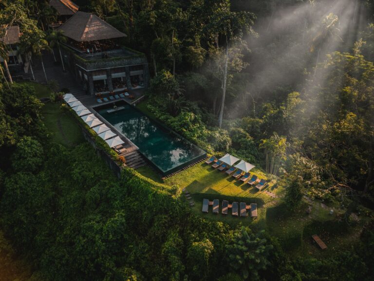 Infinity pool and cabana at sunrise, Alila Ubud