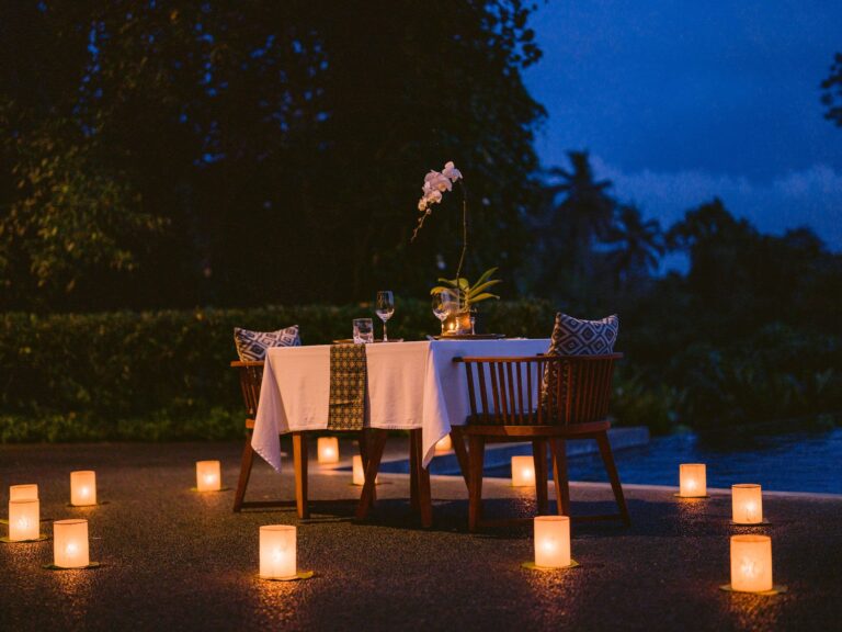 Poolside dinner table in the evening, Alila Ubud