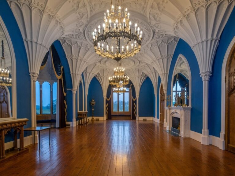 The empty Ballroom, blue Gothic arches and a polished wood floor, Allerton Castle