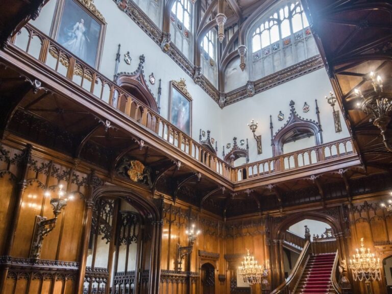 The Great Hall staircase and portrait gallery beneath the timbered roof, Allerton Castle