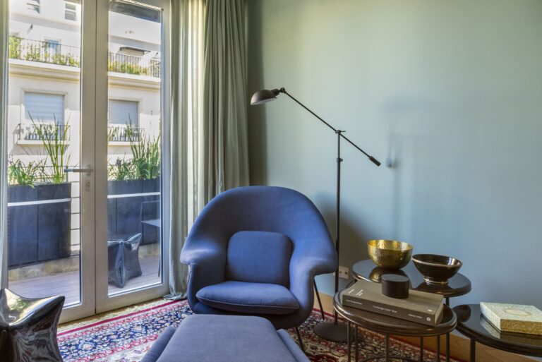 Armchair by the balcony doors in the living room, Alvear Design Guest House