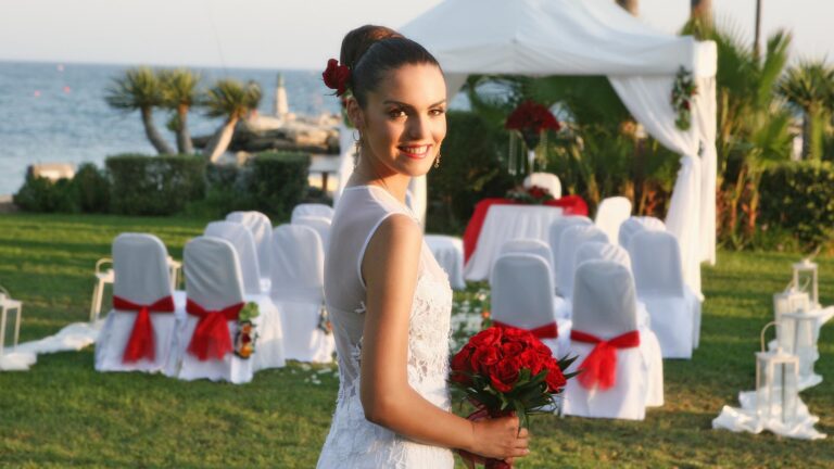 Lawn ceremony set-up with white chairs and sea view, Amathus Beach Hotel