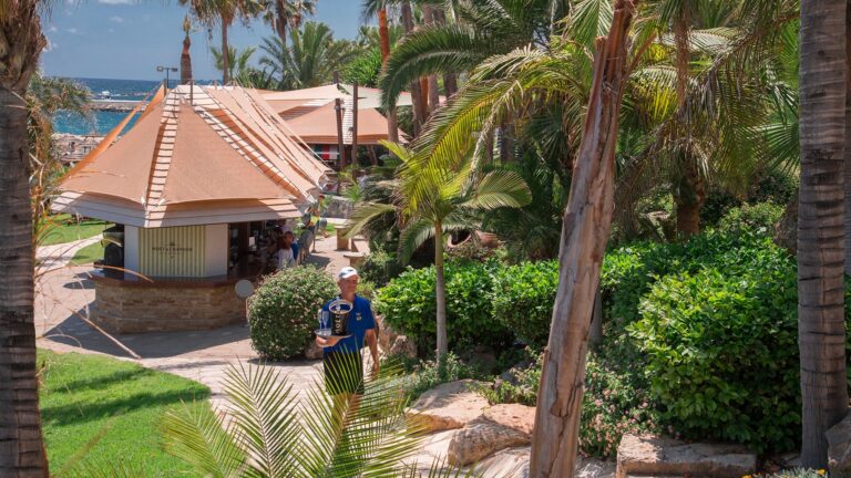Helios pool bar among the palms, Amathus Beach Hotel