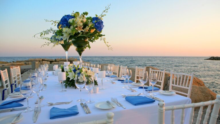 Wedding dinner table laid beside the sea, Amathus Beach Hotel