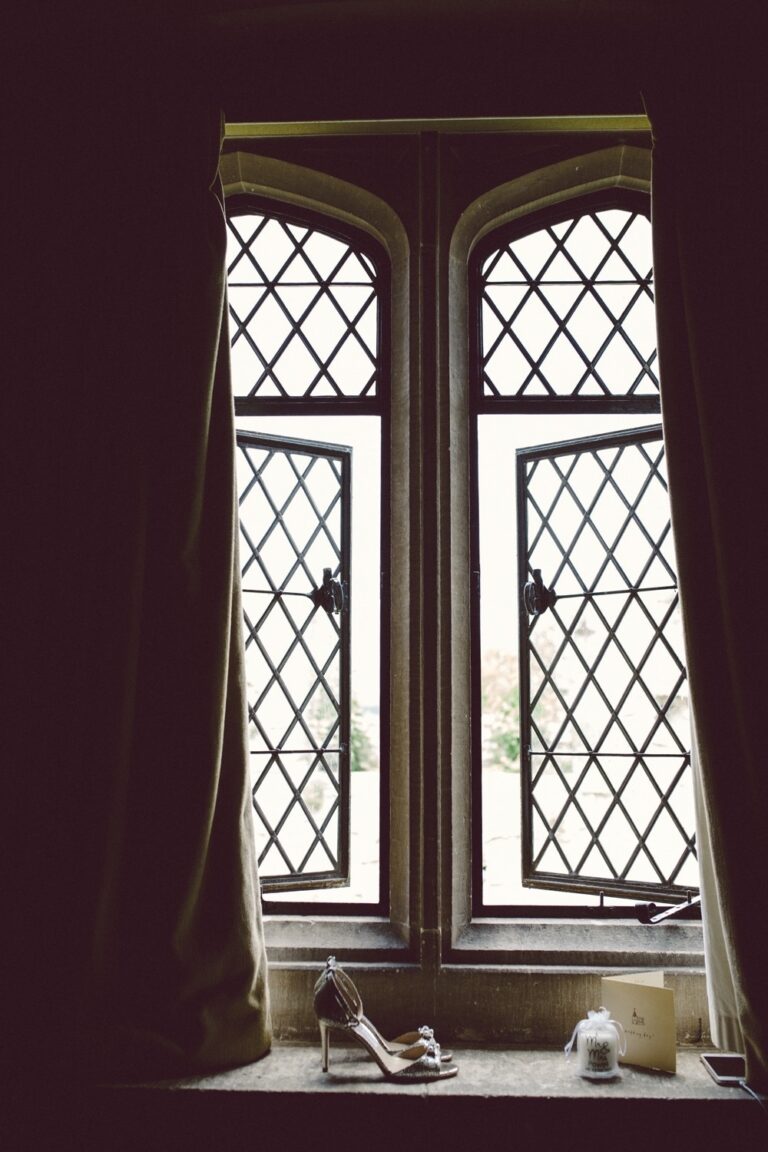 Bridal shoes on the sill of a gothic leaded window, Amberley Castle