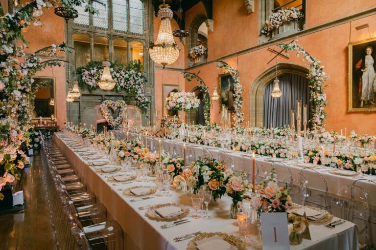 The wedding breakfast beneath the floral heart, Cowdray House, Amie Bone