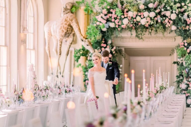 The couple beside the floral giraffe, Aynhoe Park, Amie Bone
