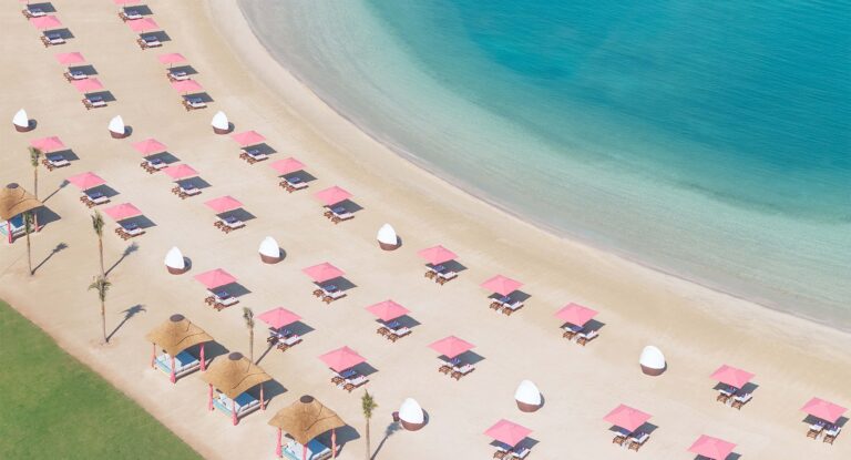 The beach and sun loungers beside the lawn from above, Anantara Mina Al Arab Ras Al Khaimah Resort