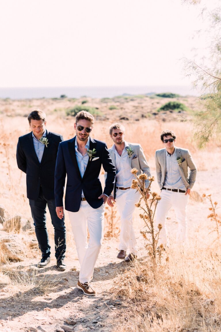 Phil and his groomsmen, walking the dry summer grass, Andreas Markakis Photography