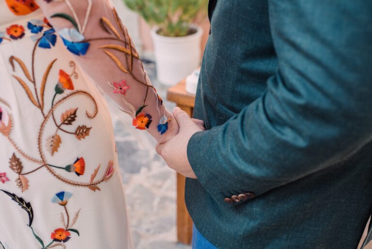 Clare's hand-embroidered dress, held tight, Andreas Markakis Photography