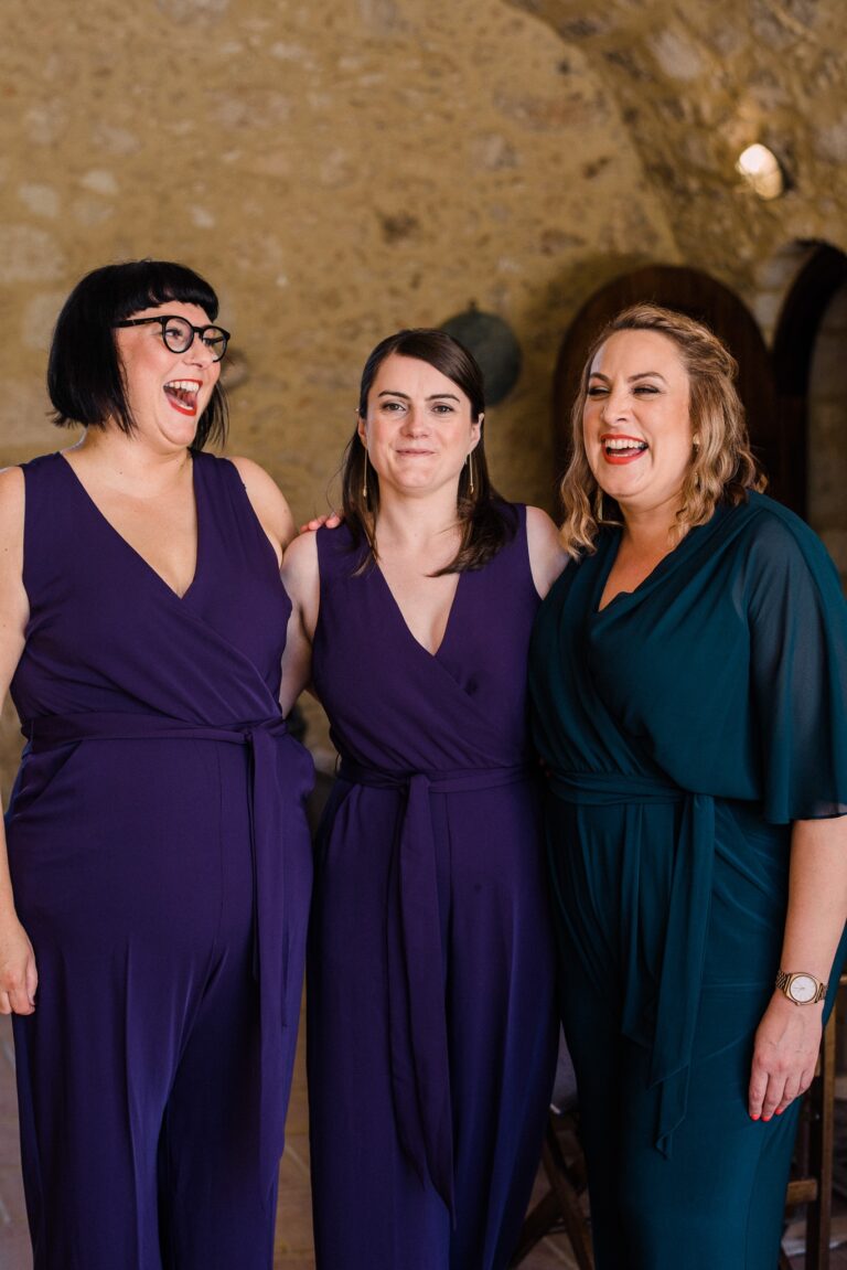 The bridesmaids, laughing under the farmhouse stone, Andreas Markakis Photography