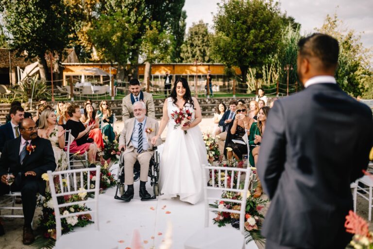 The bride walking down the aisle between guests, Lake Garda, Angela Salzano