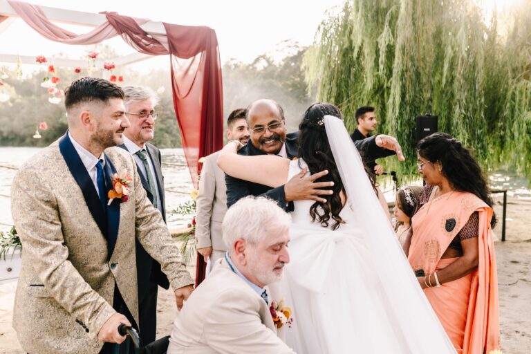 The couple embraced by family after the ceremony, Angela Salzano
