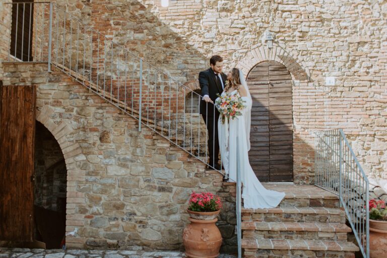 The couple on a stone staircase at a country venue, Angela Salzano