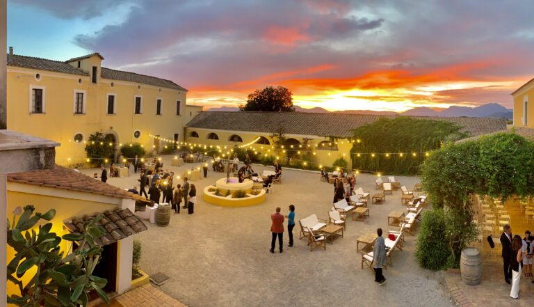 A courtyard reception lit at sunset, Angela Salzano