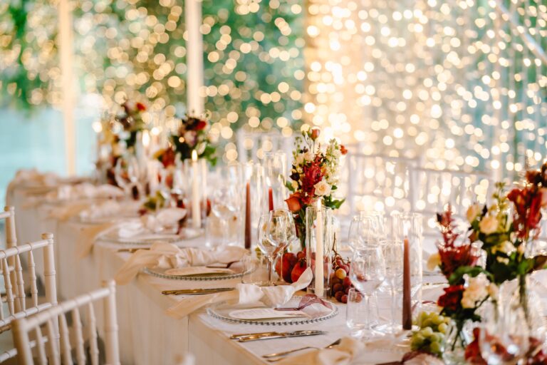 Reception table with candles, flowers and glassware, Angela Salzano